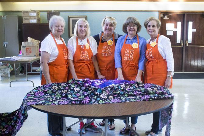 Days for Girls volunteers create feminine hygiene kits for women living in third world countries at 4264 Capital Heights Ave., on Tuesday, Oct. 31, 2017.