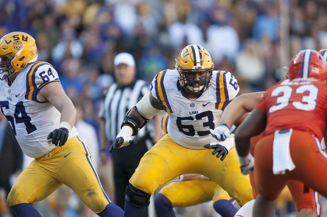 LSU junior offensive tackle K.J. Malone (63) and sophomore center William Clapp (64) take on the Florida defense during the Tigers' 16-10 loss to the Florida Gators on Saturday Nov. 19, 2016 at Tiger Stadium.