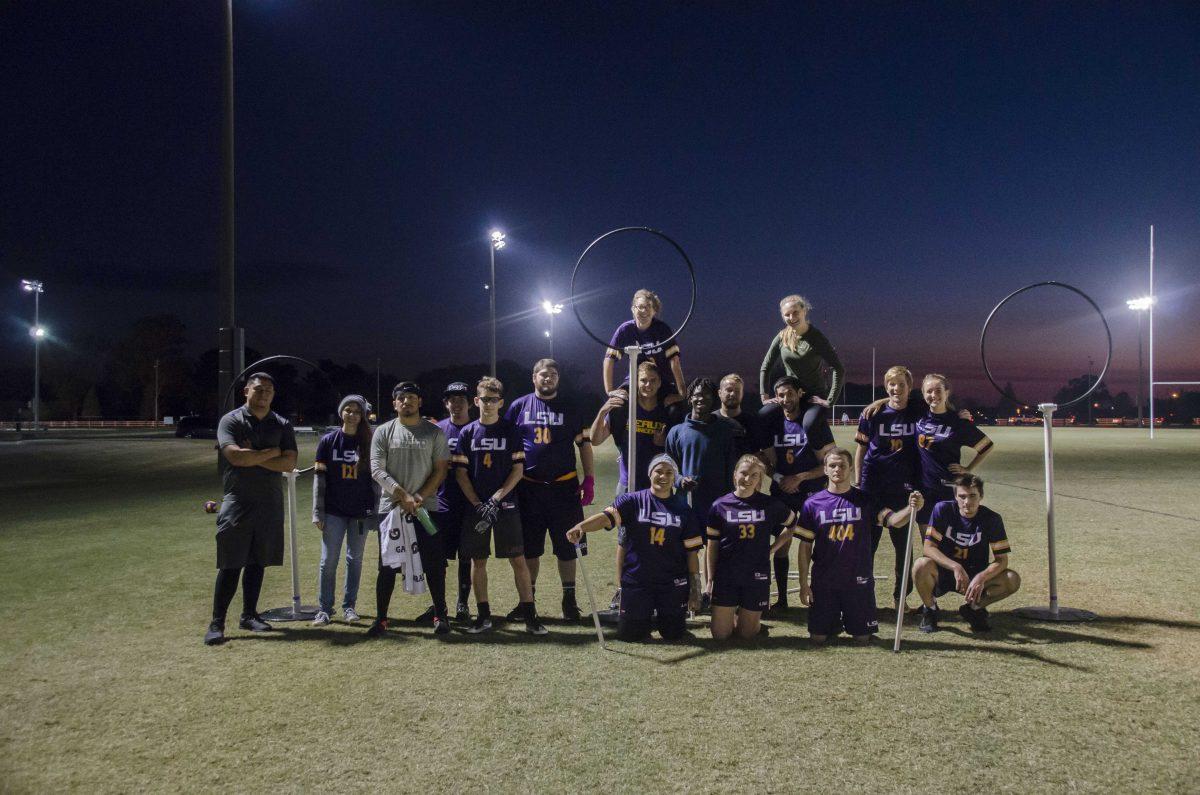 The LSU Quidditch club team poses beside the hoops on Tuesday, Nov. 11, 2017, at the UREC Field Complex.