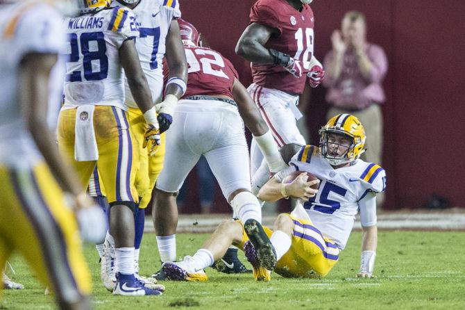 LSU freshman quarterback Myles Brennan (15) gets up after being sacked during the Tigers' 24-10 loss against Alabama on Nov. 4, 2017, at Bryant-Denny Stadium.