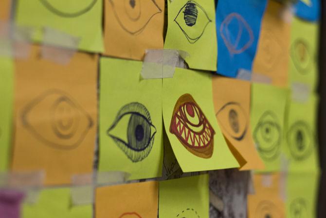 The culprit leaves drawings of eyes on sticky notes placed on a bathroom stall door to let LSU students know they are being watched on Thursday, Nov. 16, 2017, in the Studio Arts Building.