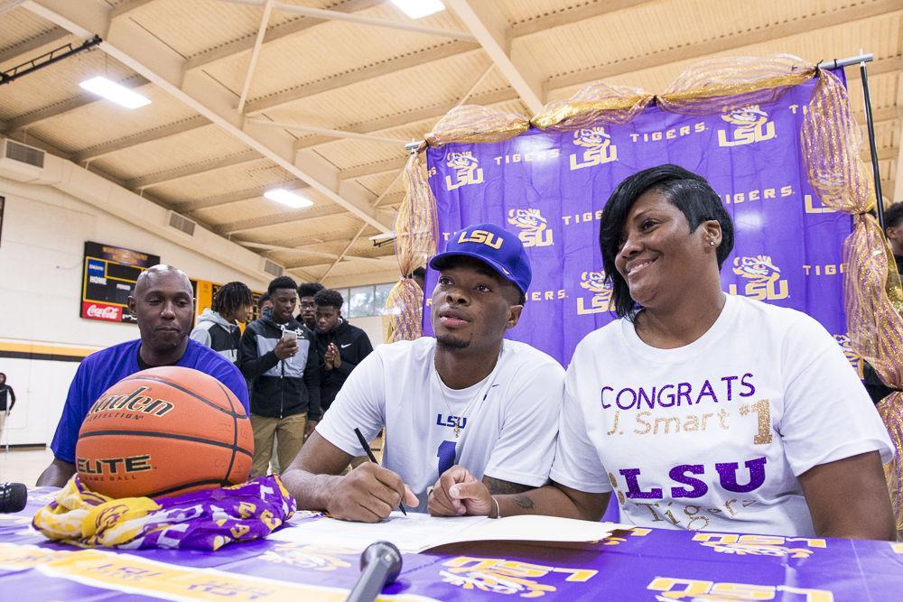 Scotlandville senior JaVonte Smart sits next to his mother Melinda Smart, right, as they begin the signing process on Nov. 8, 2017, at Scotlandville high school. Smart signed up to attend LSU for Basketball.