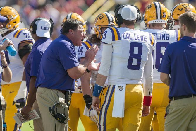 LSU Head Coach Ed Orgeron coaches the Tigers in between plays during the Tigers&#8217; 33-10 victory against Arkansas on Saturday, Nov. 11, 2017, in Tiger Stadium.