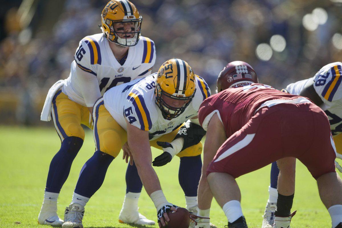 LSU senior quarterback Danny Etling (16) communicates with LSU junior offensive guard/center Will Clapp (64) before the snap during the Tigers&#8217; 33-10 victory over Arkansas on Saturday, Nov. 11, 2017, in Tiger Stadium.