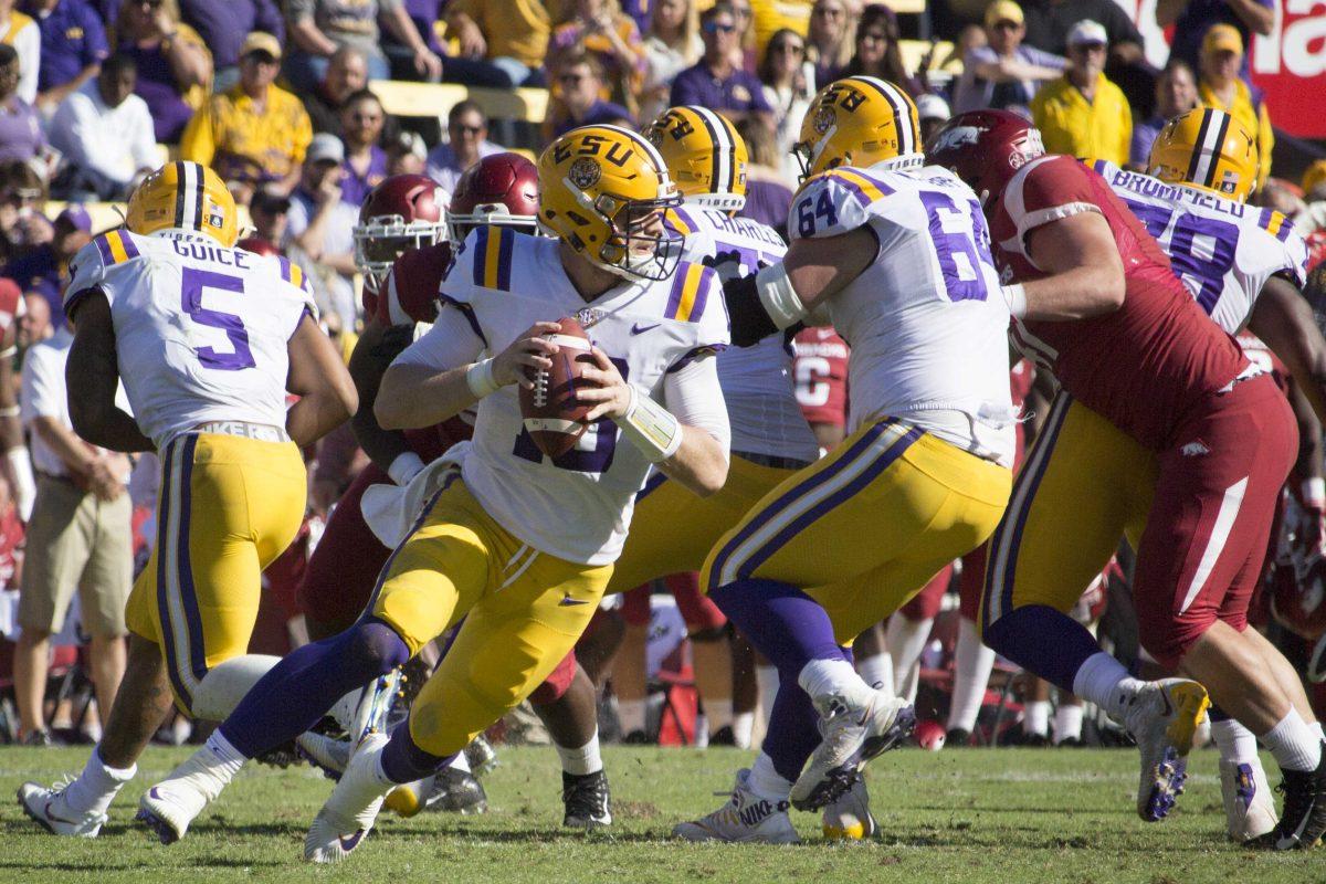 LSU senior quarterback Danny Etling (16) holds the ball before making a pass during the Tigers&#8217; 33-10 victory over Arkansas on Saturday, Nov. 11, 2017, in Tiger Stadium.