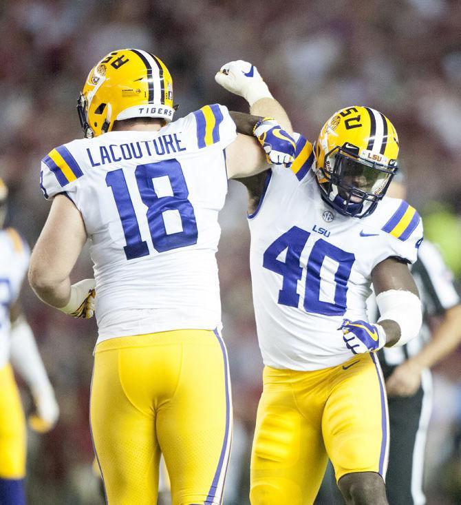 LSU senior defensive end Christian LaCouture (18) celebrates with sophomore lineback Devin White (40) during the Tigers' 10-24 loss to the University of Alabama on Saturday, Nov. 4, 2017, in Bryant&#8211;Denny Stadium in Tuscaloosa.