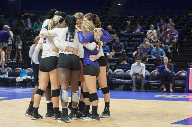 The starting players huddle up before the Lady Tigers' 3-0 win over the University of Houston on Saturday, Sept. 15, 2017, at the Pete Maravich Assembly Center.