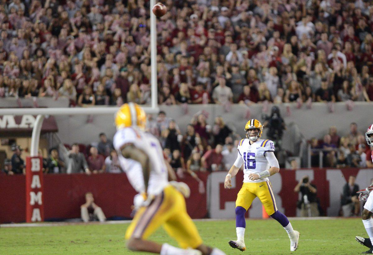 LSU senior quarterback Danny Etling (16) passes the ball to senior wide-receiver DJ Clark (7) during the Tigers' 24-10 loss against Alabama on Nov. 4, 2017, at Bryant-Denny Stadium.