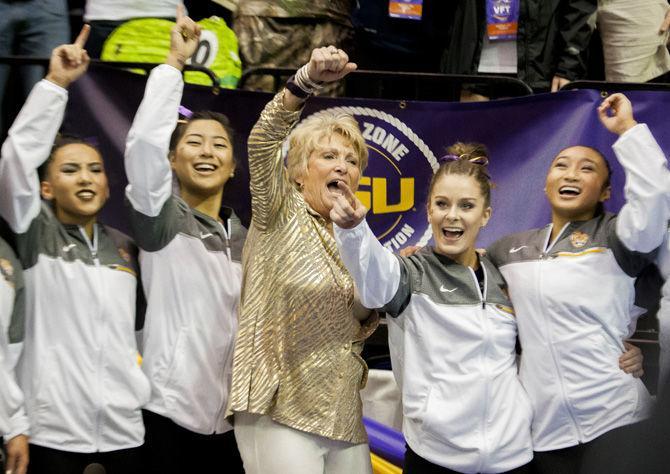 The LSU gymnastics team celebrates during the Tigers' 198.150-196.600 victory against Florida on Sunday, March 5, 2017, in the&#160;PMAC.