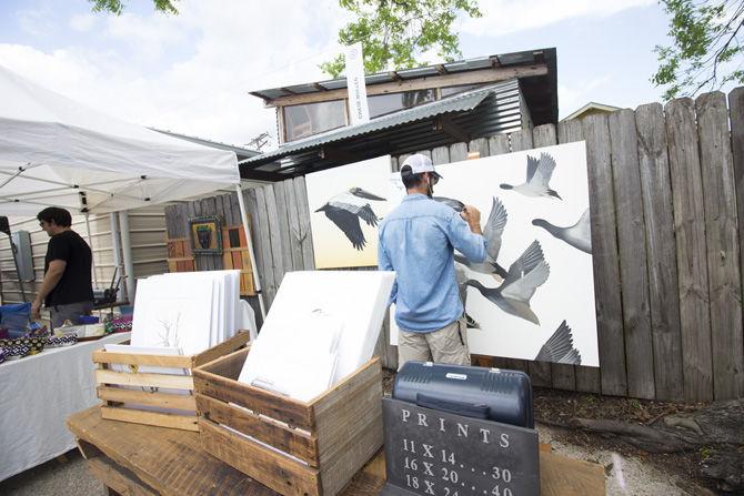 Chase Mullin paints a canvas he intends to sell at MidCity Makers Market on Saturday, April 22, 2017, at 541 South Eugene Street, Baton Rouge.