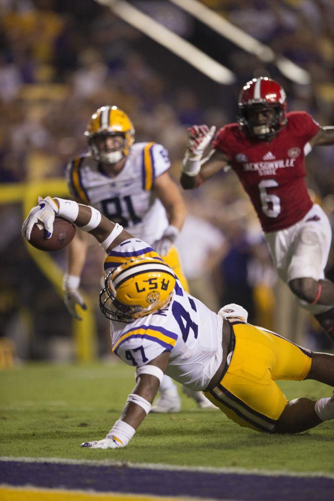 LSU sophomore fullback Bry'Kiethon Mouton (47) reaches accross the goal line in attempt to score a touchdown during the 34-13 win against the Jacksonville Gamecocks on Saturday Sept. 10, 2016, in Tiger Stadium.