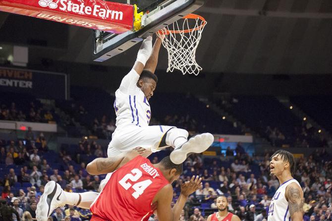 LSU senior forward Aaron Epps (21) dunks on top of defender Breaon Brady (24) during the Tigers' 80-77 victory against the Houston Cougars on Wednesday, Dec. 13, 2017, in the PMAC.