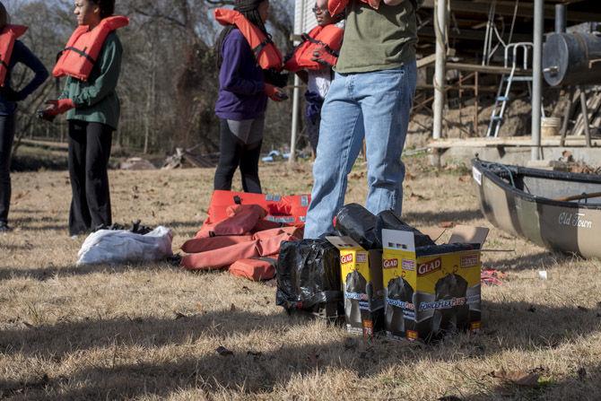 Volunteer LSU canoes Bayou Manchac in cleanup effort