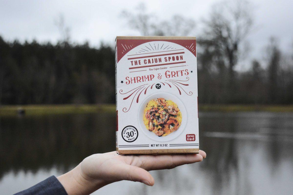 Ryan Grizzaffi holds a box of Shrimp and Grits at their neighborhood pond on&#160;Monday, Jan. 8, 2018.