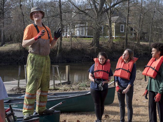 Volunteer LSU canoes Bayou Manchac in cleanup effort