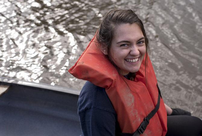 Volunteer LSU canoes Bayou Manchac in cleanup effort