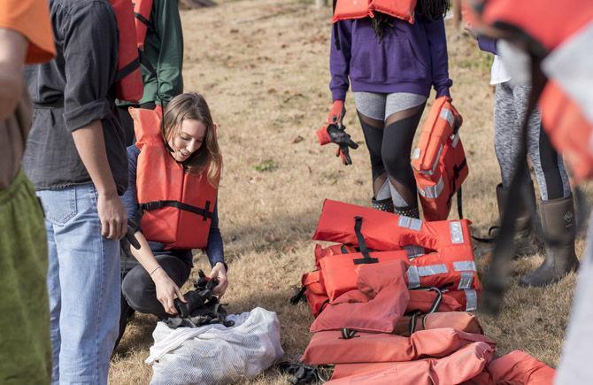 Volunteer LSU canoes Bayou Manchac in cleanup effort