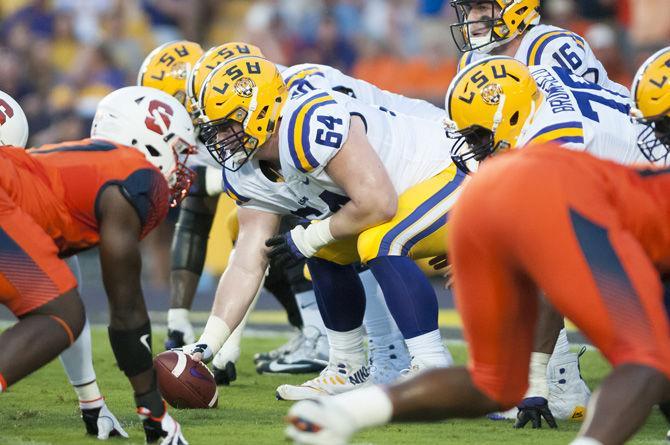 LSU junior offensive guard/ center Will Clapp (64) prepares to hike the ball during the Tigers' 35-26 victory against Syracuse on Saturday, Sept. 23, 2017, in Tiger Stadium.