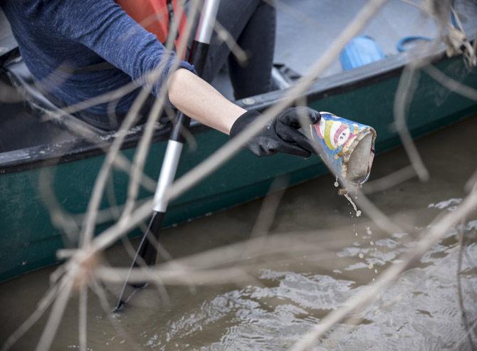 Volunteer LSU canoes Bayou Manchac in cleanup effort