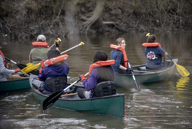 LSU student volunteers row down Bayou Manchac on Sunday, Jan. 21, 2018.