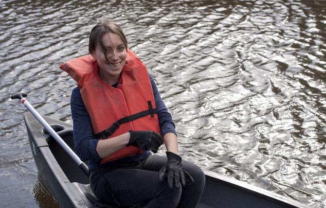 Volunteer LSU canoes Bayou Manchac in cleanup effort