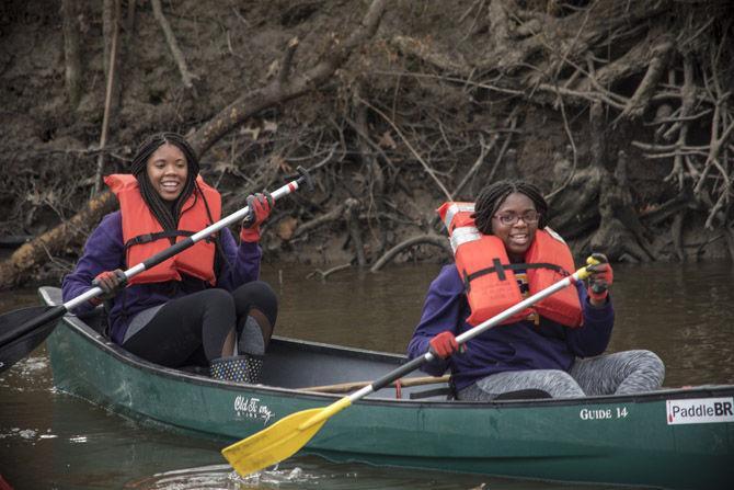 Volunteer LSU canoes Bayou Manchac in cleanup effort