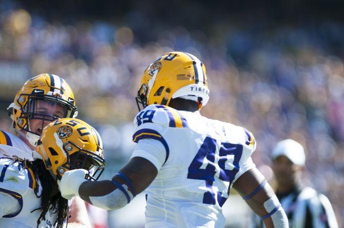 LSU junior defensive back Donte Jackson (1) and LSU junior linebacker Arden Key (49) congratulate each other after making a great play during the Tigers&#8217; 33-10 victory against Arkansas on Saturday, Nov. 11, 2017, in Tiger Stadium.