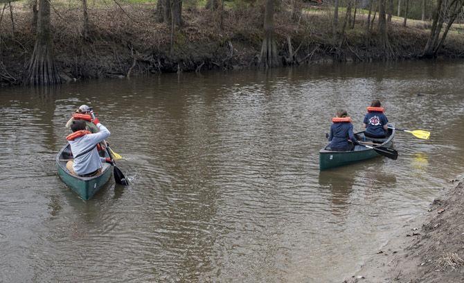 Volunteer LSU canoes Bayou Manchac in cleanup effort