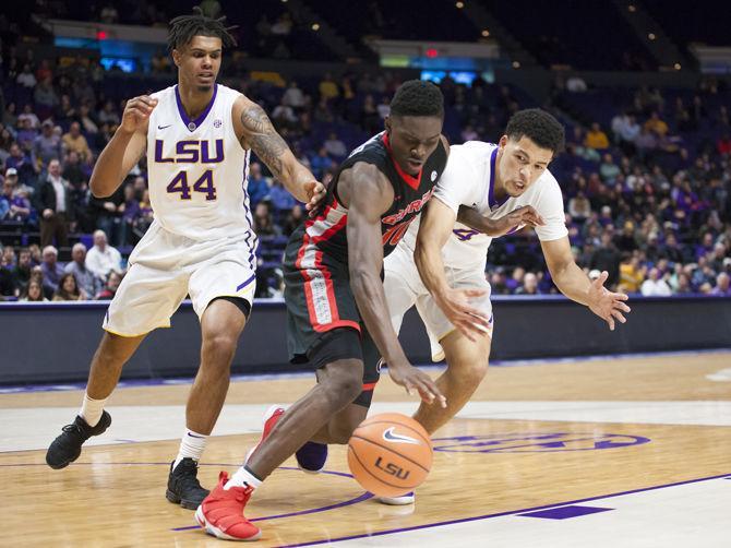 LSU sophomore forward Wayde Sims (44) and sophomore guard Skylar Mays (4) fight for the ball from a Georgia player during the Tigers' 61-60 loss to Georgia on Tuesday, Jan. 16, 2018, in the PMAC