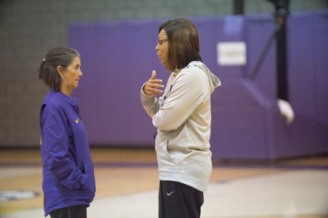 Head coach Nikki Fargas and assistant coach Mickie DeMoss talk during warm-ups on Friday Nov. 18, 2016 in the basketball practice facility.