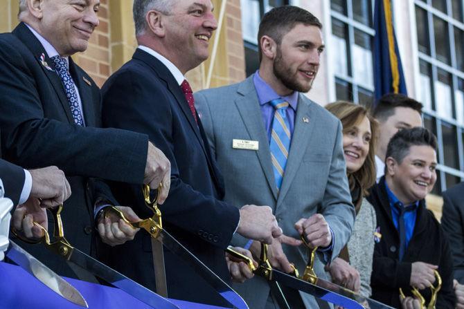 Event speakers and Brookshire family members gather around to cut the ceremonial ribbon on Wednesday, Jan. 31, 2018, at the William A. Brookshire Military &amp; Veterans Student Center Ribbon Cutting Ceremony.