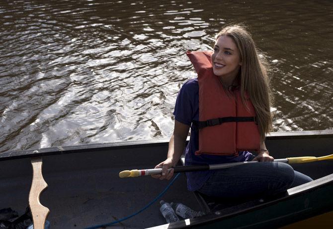 Volunteer LSU canoes Bayou Manchac in cleanup effort