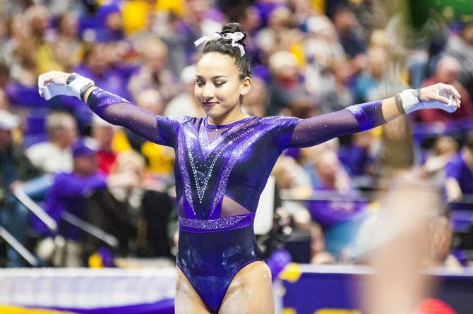 LSU senior Myia Hambrick performs her uneven bars routine during the Tigers' 197.15-195.350 victory against Arkansas on Friday, Jan. 5, 2018, in the PMAC.