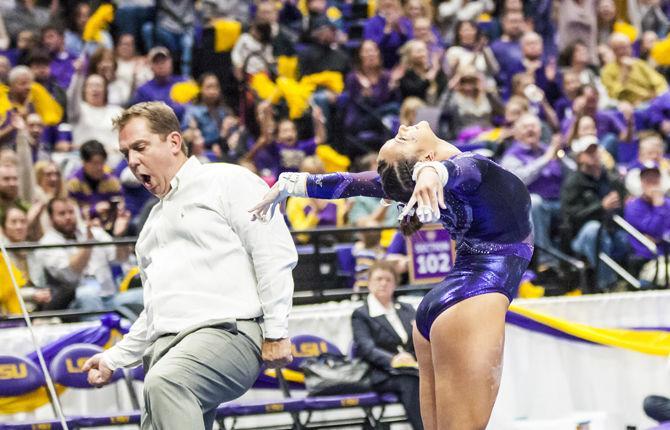 LSU junior Sarah Finnegan lands her uneven bars routine during the Tigers' 197.15-195.350 victory against Arkansas on Friday, Jan. 5, 2018, in the PMAC.