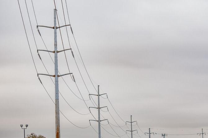 Large power lines stand tall along LSU's west campus border on Tuesday, Jan. 8, 2018.