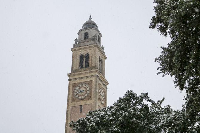 Memorial Tower takes on snowfall on Friday, Dec. 8, 2017.