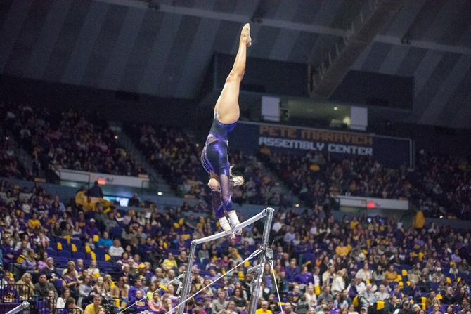 LSU freshman Sami Durante performs her uneven bars routine during the Tigers' 197.15-195.350 victory against Arkansas on Friday, Jan. 5, 2018, in the PMAC.