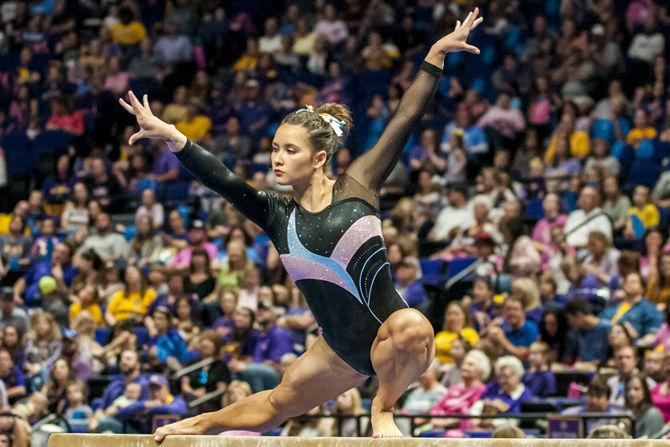 LSU all-around junior Sarah Finnegan competes in the beam competition during the Tigers' 198.175-194.200 victory over Texas Woman's University on Sunday, Feb. 18, 2018.