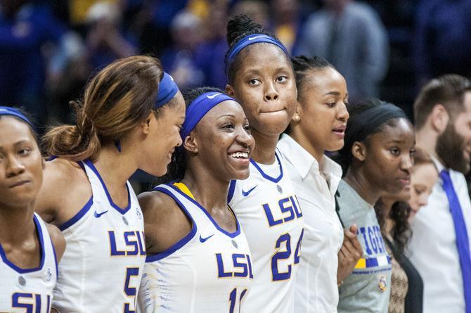 Ending her final home game, LSU senior guard Raigyne Louis (11) sings the Alma Mater after the Tigers' 79-78 win against Alabama on Sunday, Feb. 25, 2018, in the PMAC.