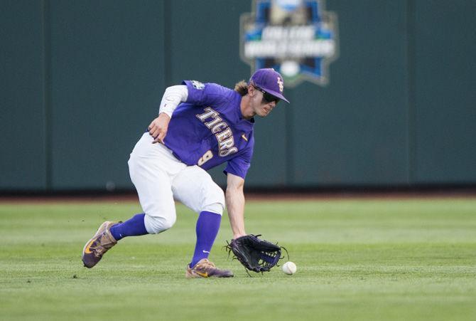 LSU freshman outfielder Zach Watson (9) rushes to field a ball during LSU's 6-1 loss to Florida in game two of the College World Series on Tuesday June 27, 2017, at the TD Ameritrade Center in Omaha, Nebraska.