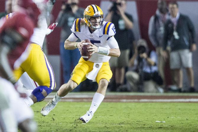 LSU freshman quarterback Myles Brennan (15) runs the ball downfield during the Tigers' 24-10 loss against Alabama on Nov. 4, 2017, at Bryant-Denny Stadium.