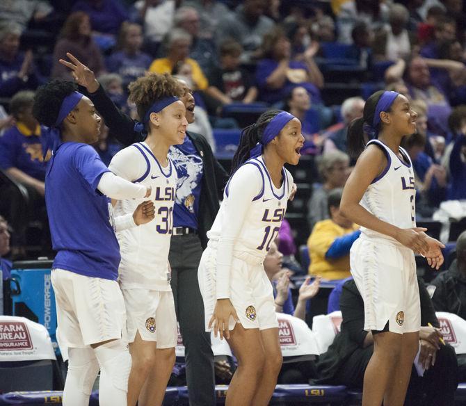 LSU team members Jailin Cherry (30), Dekeriya Patterson (10) and Khayla Pointer (3) cheer during the Tigers' 70-59 victory over Tennessee on Sunday, Jan. 28, 2018 in the PMAC.