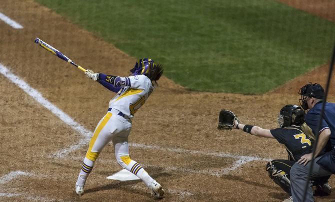 LSU junior infielder Amber Serrett (17) hits the ball during the Tigers' 4-0 victory over University of Southern Mississippi on Friday, Feb. 9, 2018 in Tiger Park.