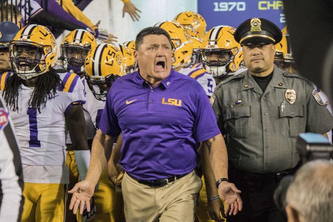 LSU Head Coach Ed Orgeron leads the team onto the field before the Tigers&#8217; 45-21 victory against Texas A&amp;M on Saturday, Nov. 25, 2017, in Tiger Stadium.