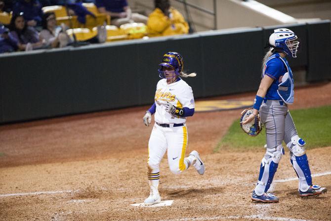 LSU senior outfielder Emily Griggs (8) scores a run during the Tigers' 9-2 victory over University of Texas Arlington on Friday, Feb. 9, 2018 in Tiger Park.