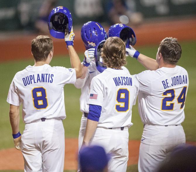 LSU baseball celebrates after a homerun during the Tigers' 7-6 victory against Notre Dame on Friday, Feb. 16, 2018, in Alex Box Stadium.