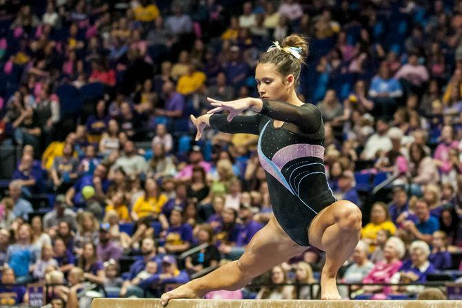 LSU all-around junior Sarah Finnegan competes in the beam competition during the Tigers' 198.175-194.200 victory over Texas Woman's University on Sunday, Feb. 18, 2018.