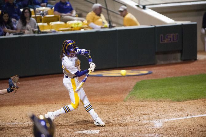 LSU junior infielder Amber Serrett (17) hits the ball during the Tigers' 11-6 victory over University of Texas at Arlington on Friday, Feb. 9, 2018 in Tiger Park.