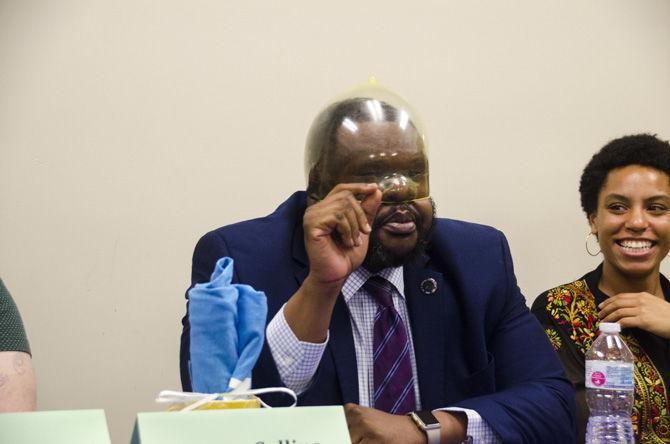 Panelist Eugene Collins showcases the size of a condom on National Black HIV/AIDS Awareness Day on Wednesday, Feb. 7, 2018, in the Women&#8217;s Center on LSU campus.