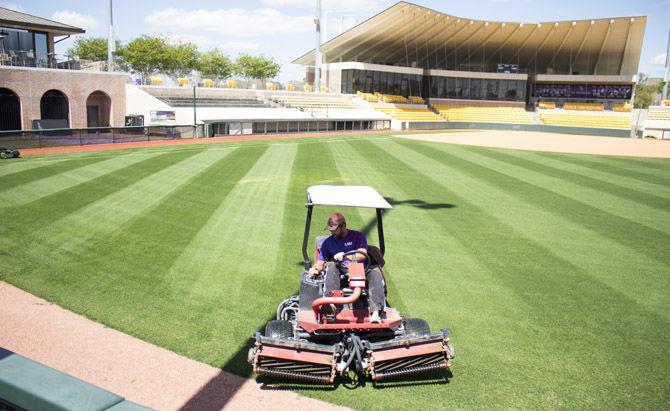 The groundskeepers mow the field at Tiger Park&#160;on Tuesday, March 20, 2018.